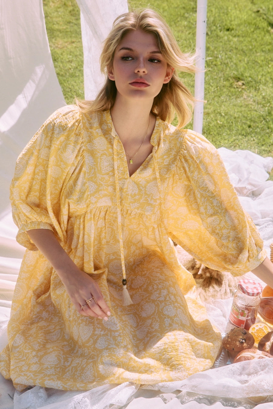 Printed midi dress with a gathered split neckline, tassel ties, and voluminous 3/4 puff sleeves.> yellow