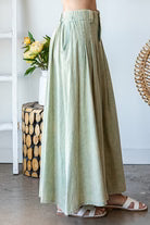 PLEATED FLARE HEM MAXI SKIRT