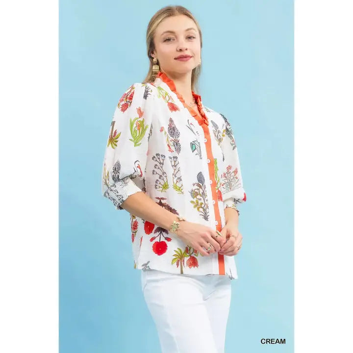 orange ruffle cream top