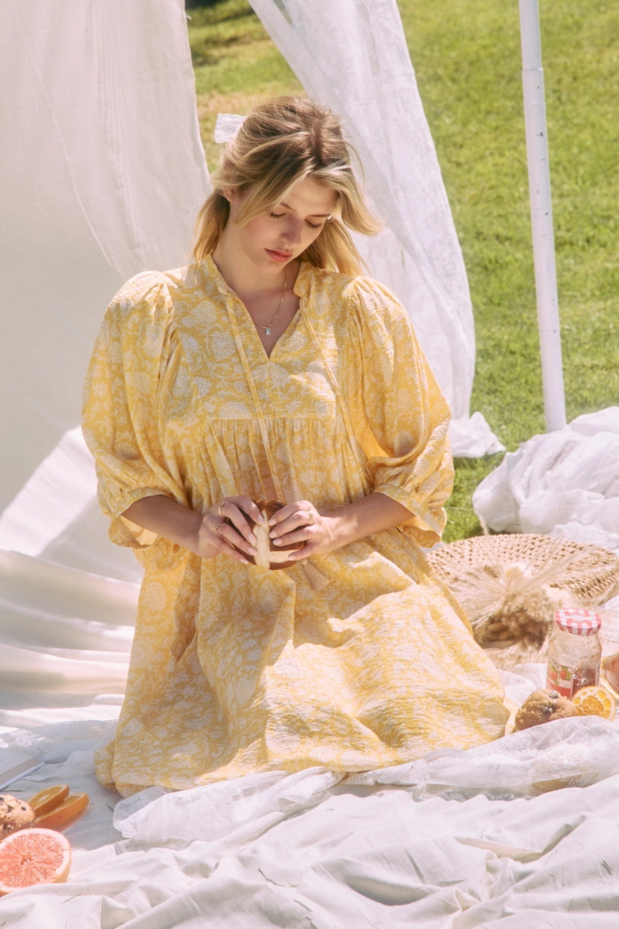 Printed midi dress with a gathered split neckline, tassel ties, and voluminous 3/4 puff sleeves.> yellow