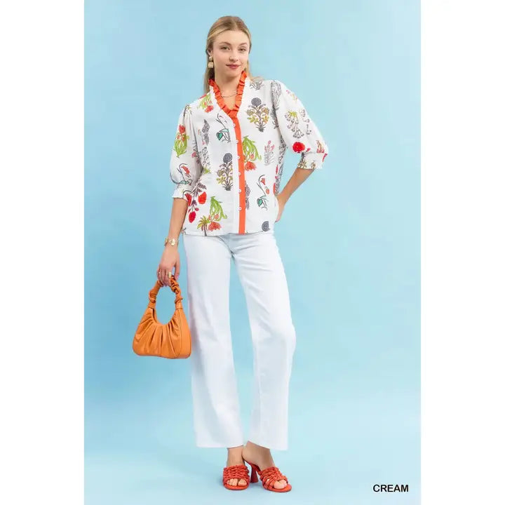 orange ruffle cream top