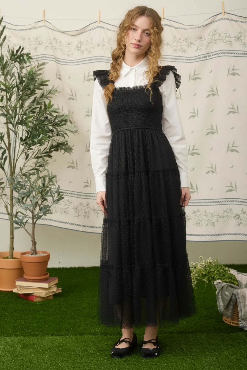 Black ruffle-strap maxi dress layered over a white long-sleeve shirt