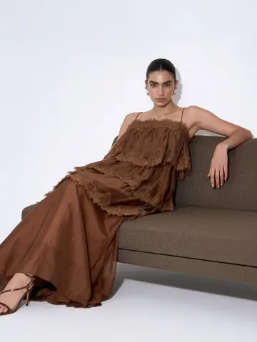 Chocolate-brown ruffle maxi dress with a flowing floor-length skirt
