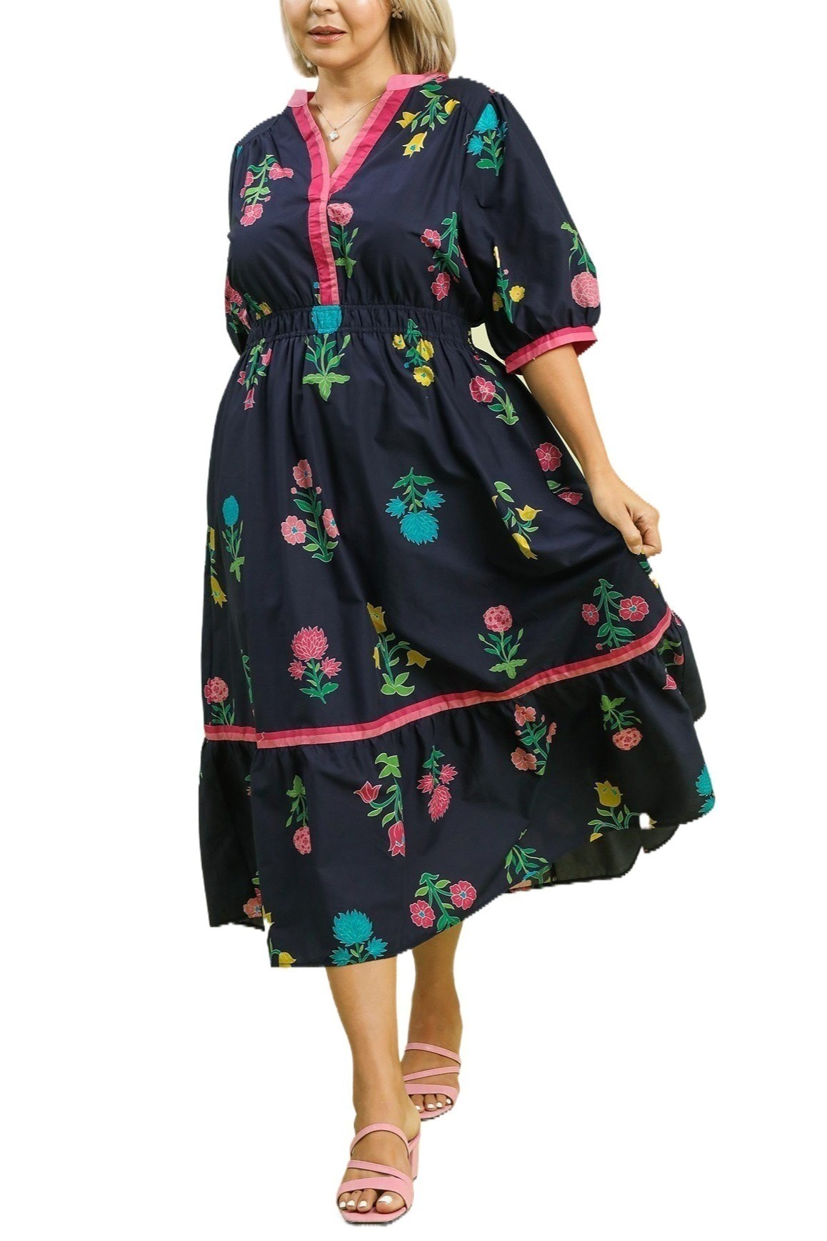 Navy floral midi dress with pink contrast trim, V neckline, puff sleeves, and a gathered tiered skirt