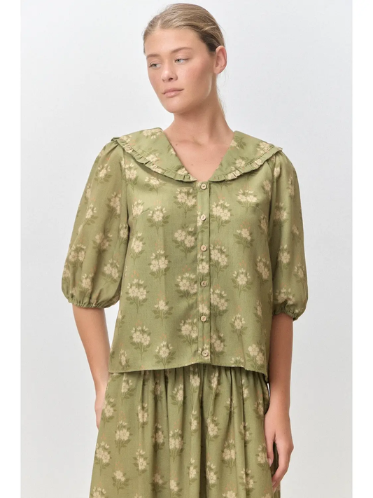 Sage green floral Peter Pan collar top with ruffle trim, button front, and puff sleeves