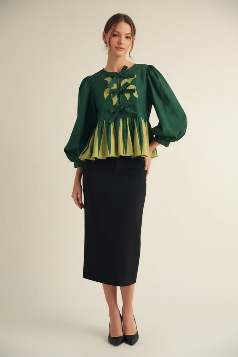 Emerald Leaf Embroidered Peplum Blouse styled with a black midi skirt