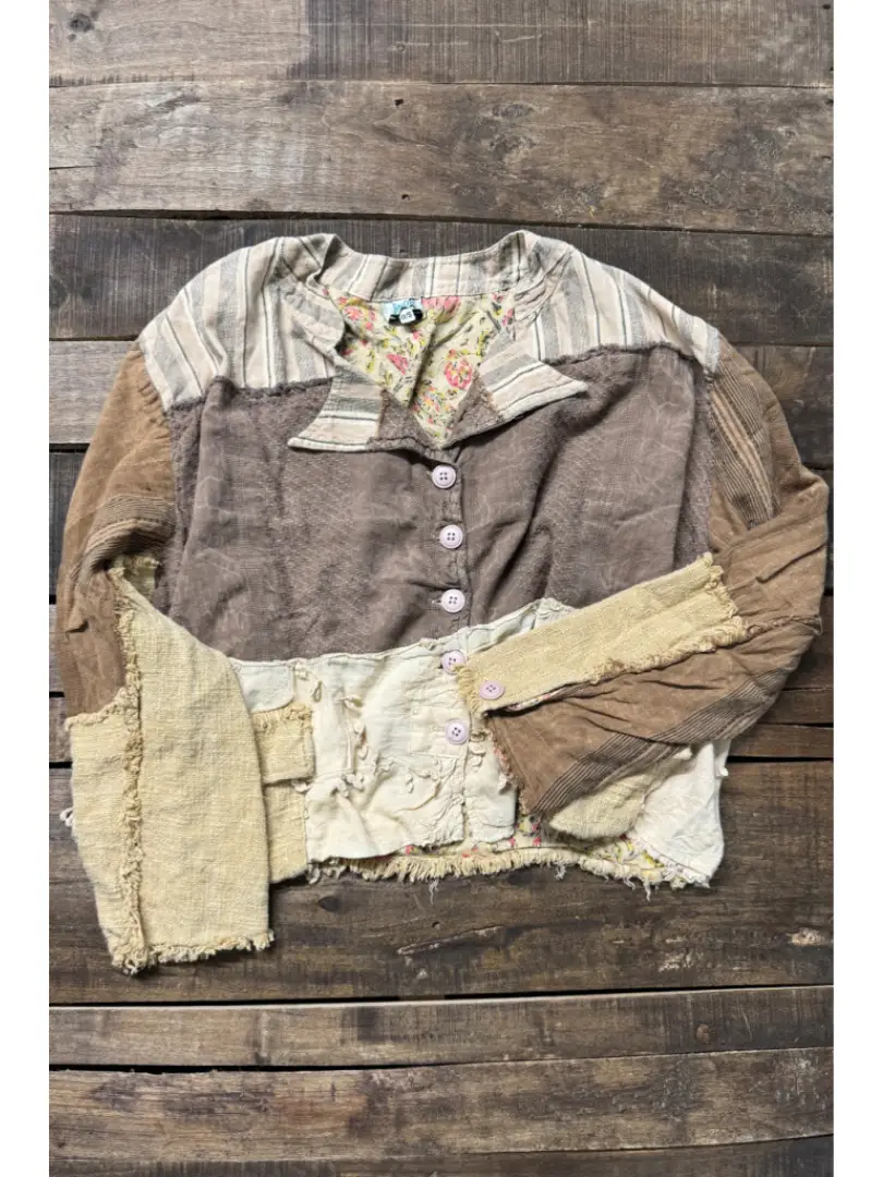 Earth-tone patchwork button-front jacket with striped shoulders, floral accents, and frayed edges.