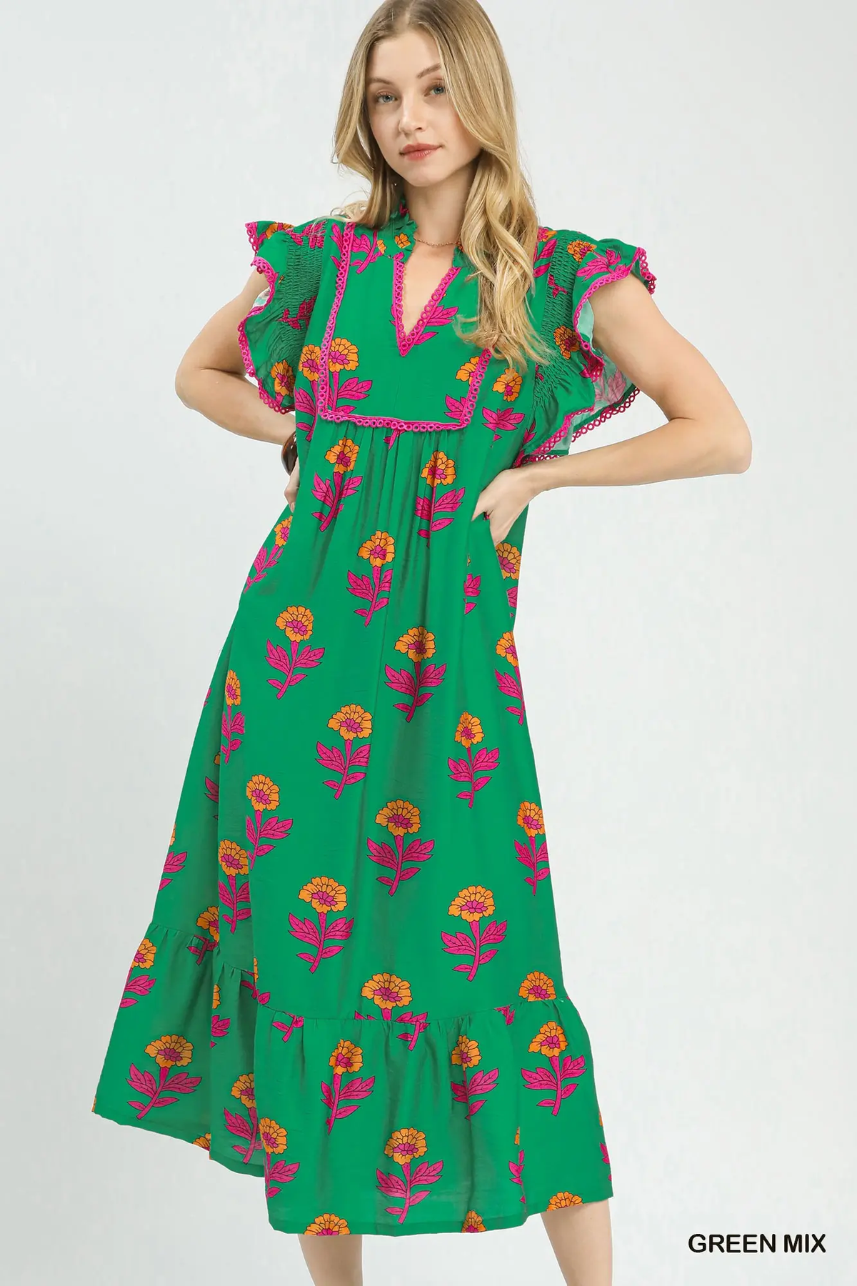 Green Mix floral midi dress with warm-colored flowers, pink trim, flutter sleeves, and ruffled hem