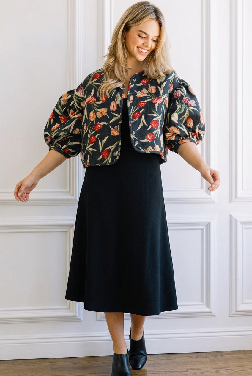 Model wearing the floral jacket with a black midi skirt